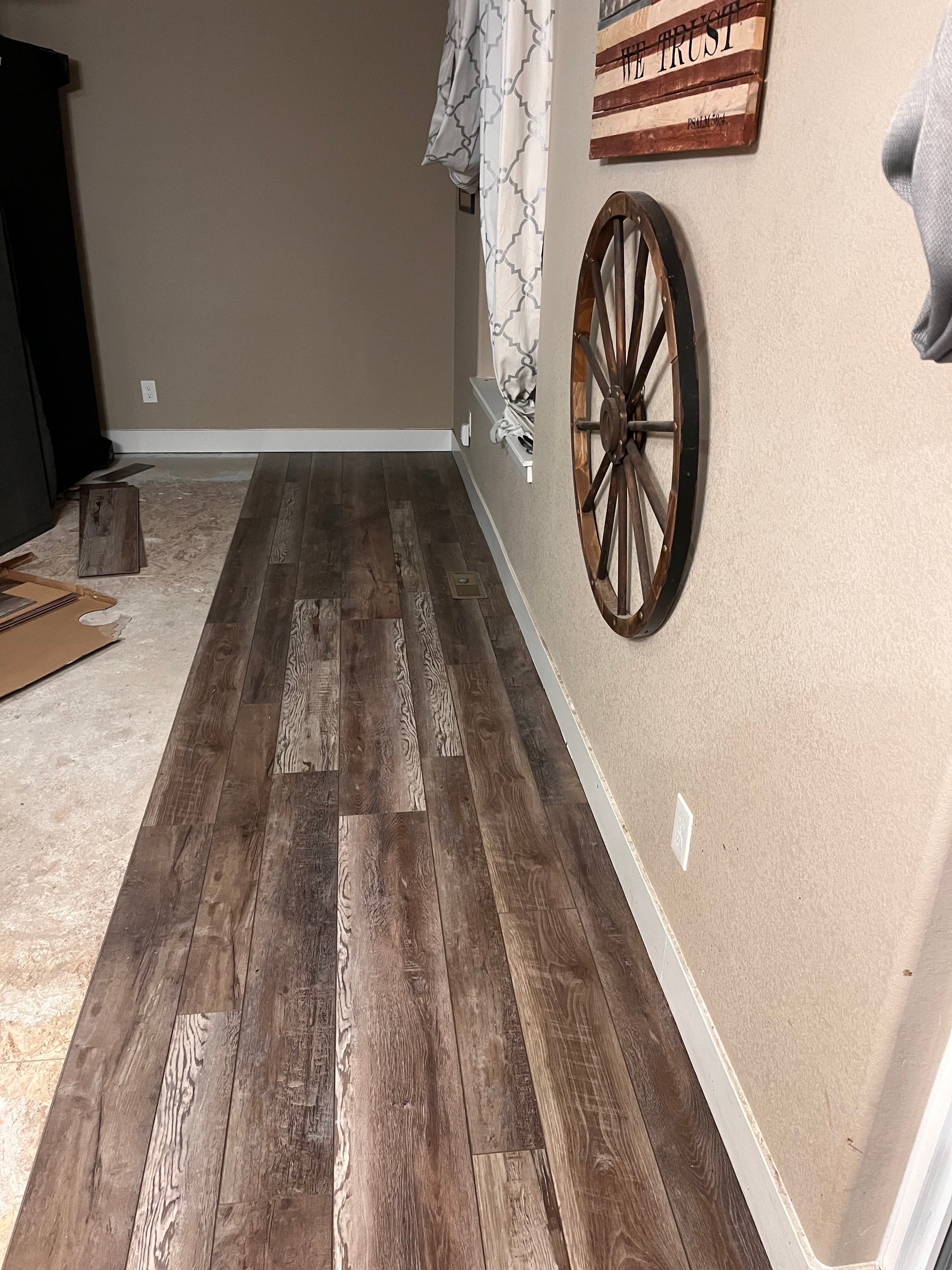 Before — wood plank accent wall installation in progress