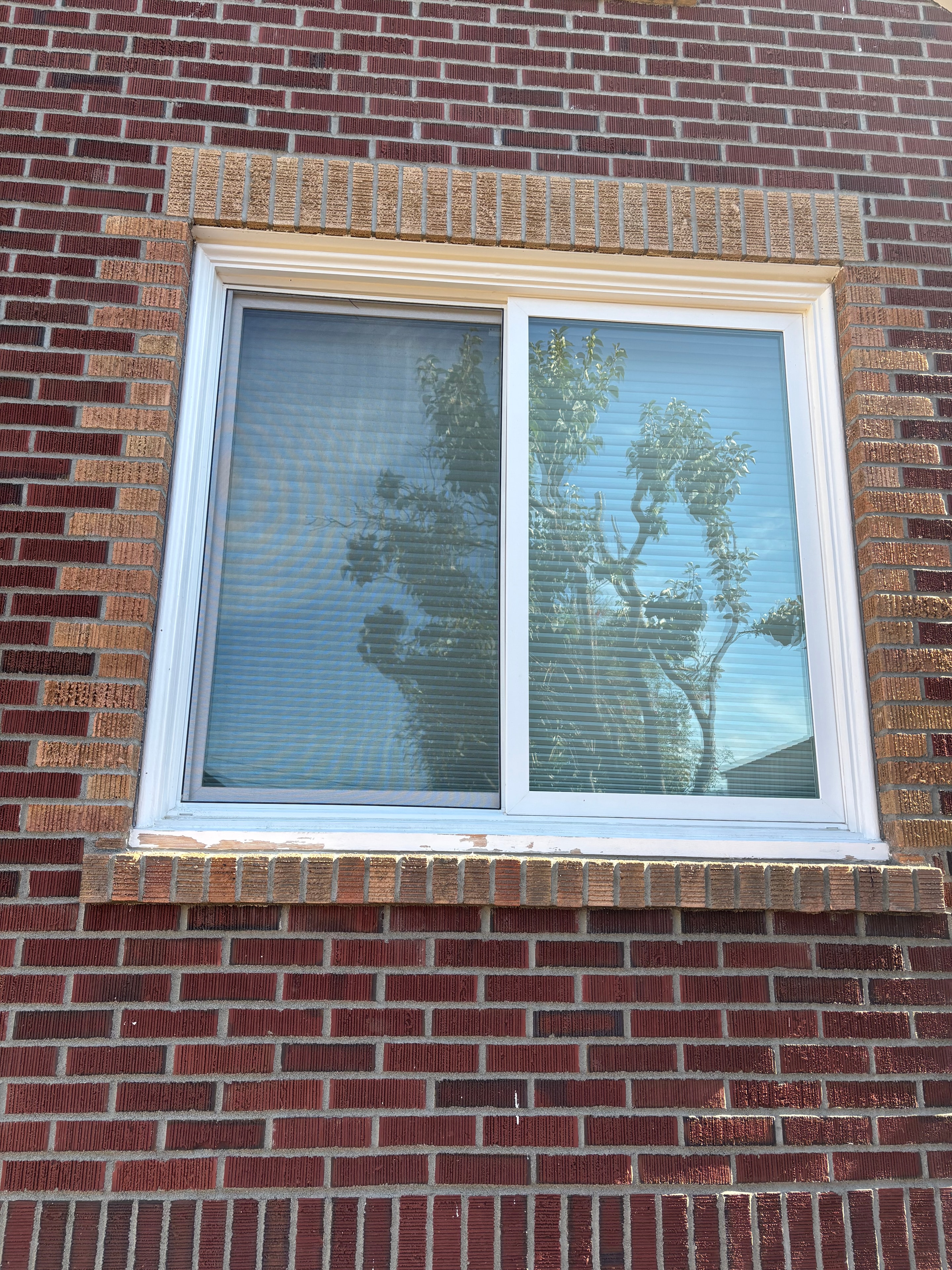 Before — unpainted brick exterior
